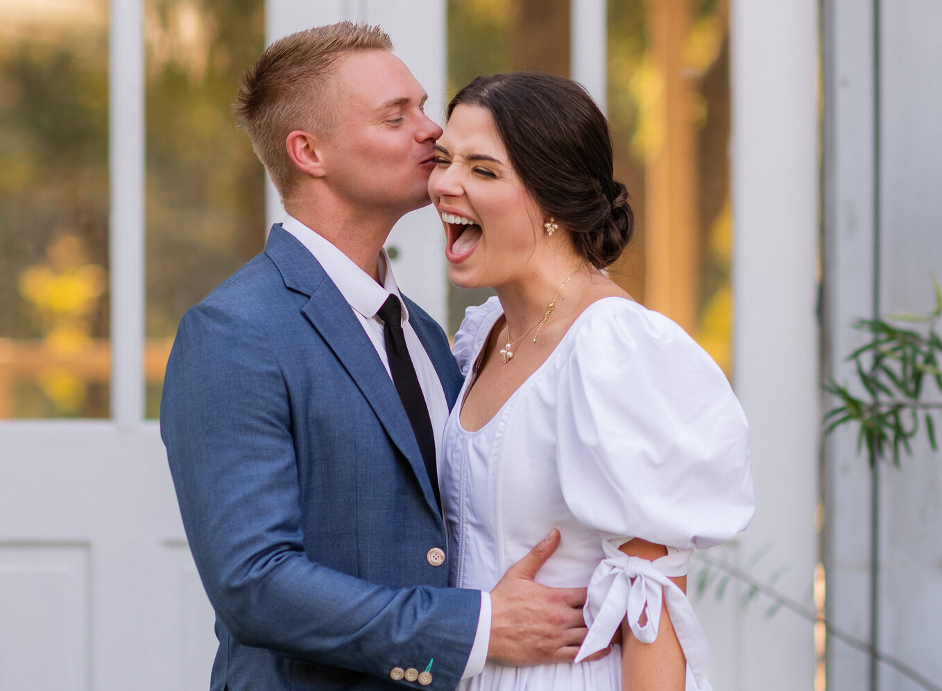 Bride and groom sharing a romantic moment at The Rosewood on Lake Placid, captured by a San Antonio wedding photographer